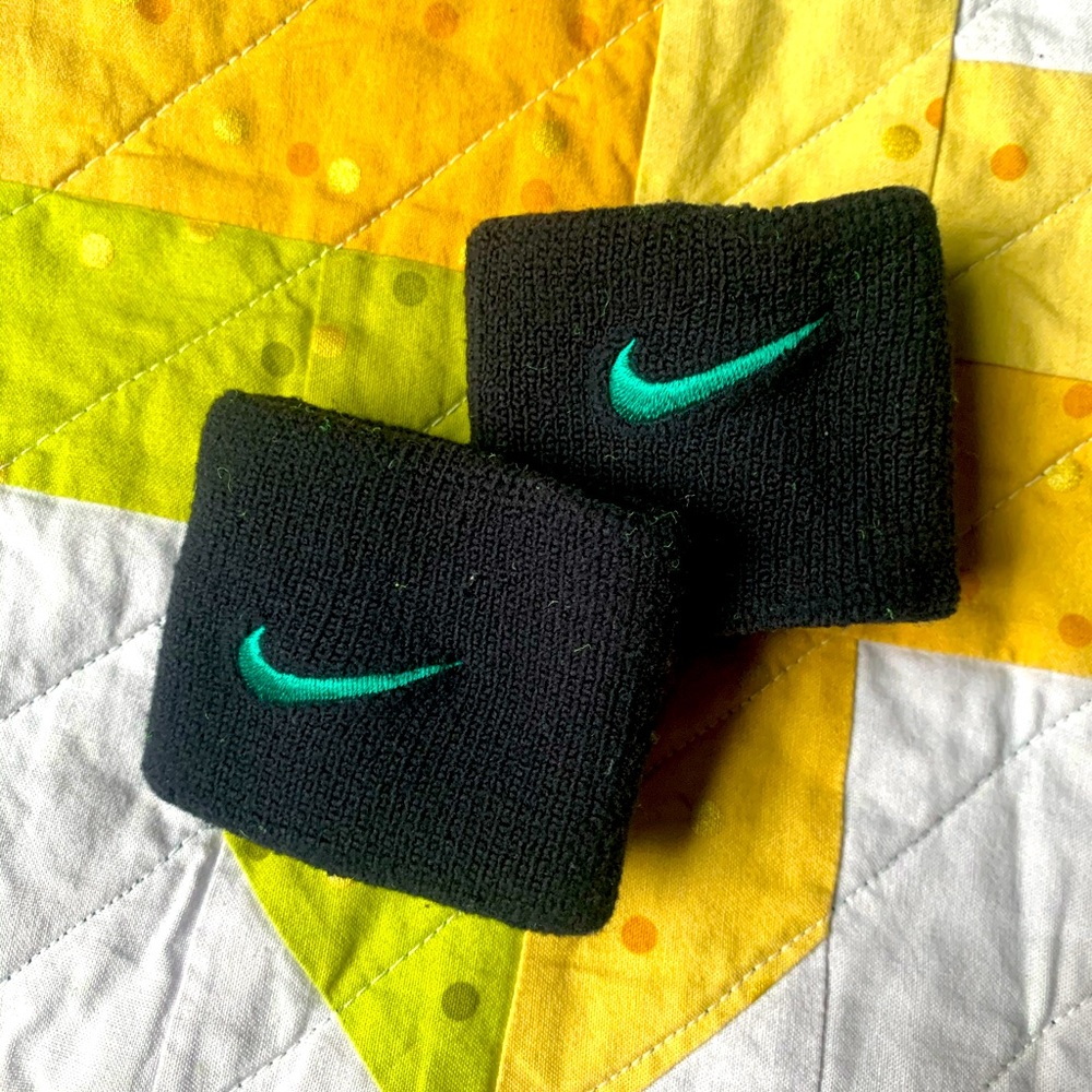 Black and green Nike sweatbands